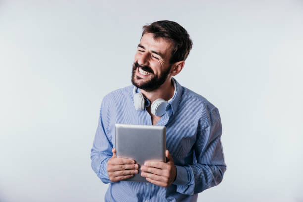 istock Attractive programmer in the blue shirt is standing in studio 1265150915