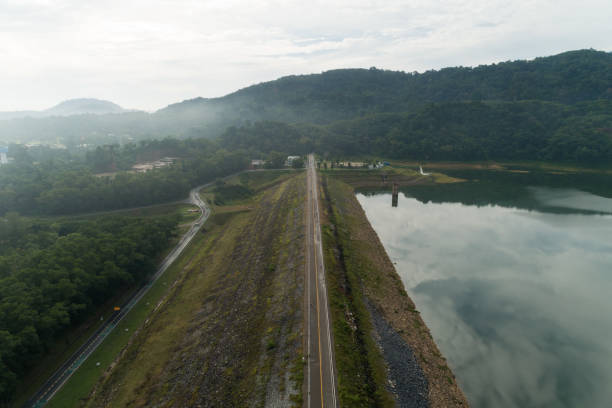 istock Asphalt road with yellow line on road image by drone camera high angle view. 1265151761