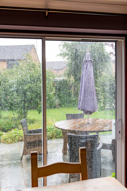 istock Back garden viewed through a patio door on a rainy day 1265151891