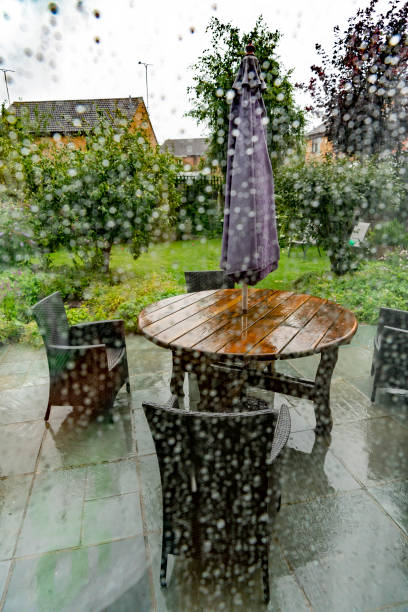 istock Back garden viewed through a patio door on a rainy day 1265152042