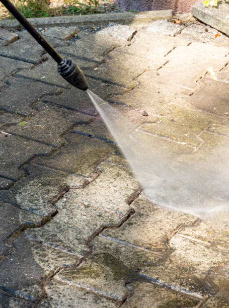 istock old cleaning the terrace with high pressure cleaner 1265154591