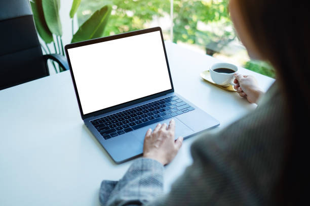 istock a businesswoman using and touching on laptop touchpad with blank white desktop screen in the office 1265154712