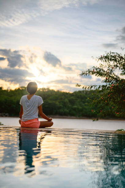 istock Meditation on the edge of the pool 1265154892