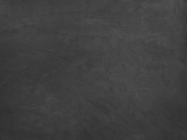 istock Black and white background. Plastered concrete wall texture. Close-up. 1265157777