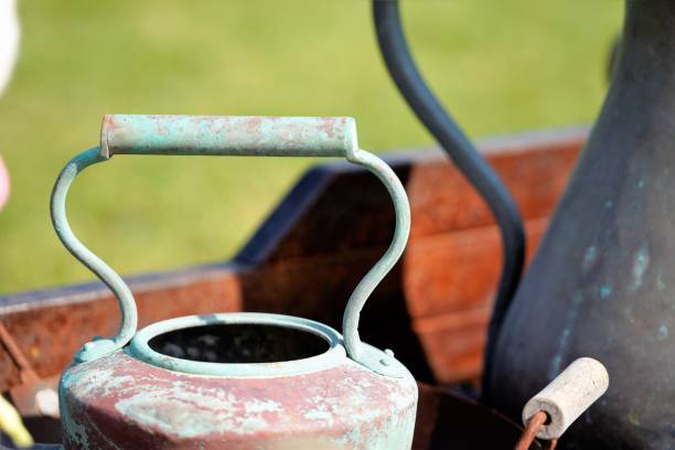 weathered copper old kettle by blurred background