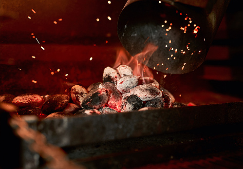 Closeup shot of charcoal burning in a fireplace