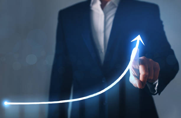 istock usinessman drawing on screen growing graph. Business development concept. 1265159209