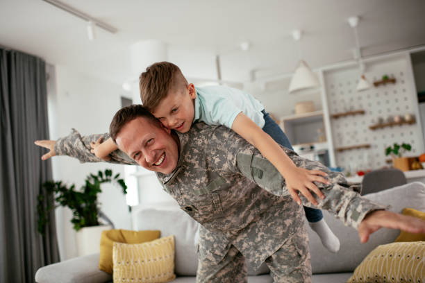 istock Soldier enjoying at home with children. 1265160065