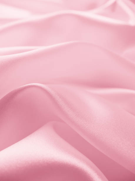 istock Beautiful elegant wavy light pink satin silk 1265160095