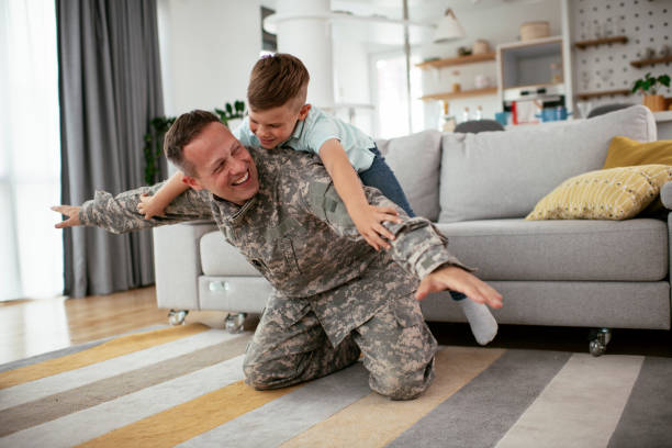 istock Soldier enjoying at home with children. 1265160128