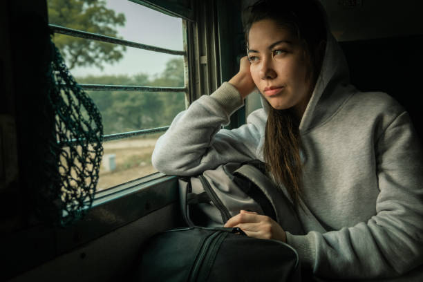 istock Young female passenger travel by passenger Train 1265161805
