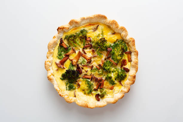 Whole broccoli and mushrooms pie Whole broccoli and mushrooms pie chanterelle edible mushroom gourmet uncultivated stock pictures, royalty-free photos & images