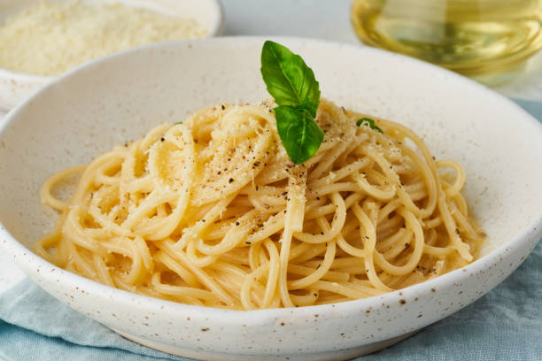 istock Cacio e pepe pasta. Spaghetti with parmesan cheese and pepper. 1265165438