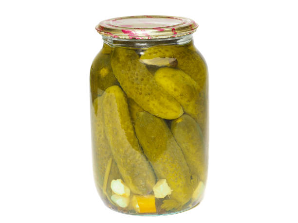 istock Glass jar with homemade pickled cucumbers on a white background 1265167035