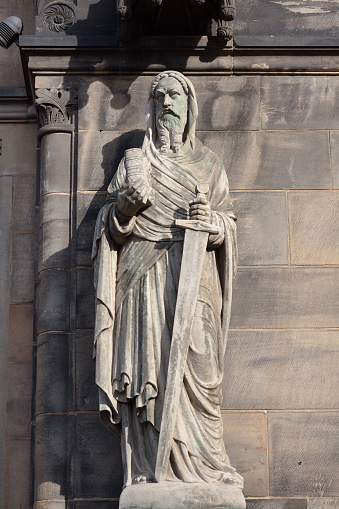 Salamanca, Spain - Mar 16, 2019: Fray Luis de Leon Statue in front of Old University of Salamanca Building - Salamanca, Spain