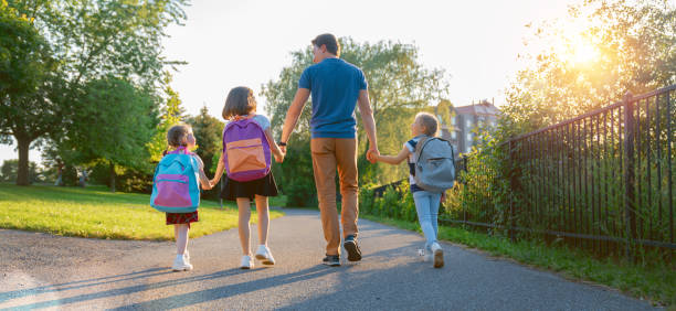 istock Parent and pupils are going to school 1265167639