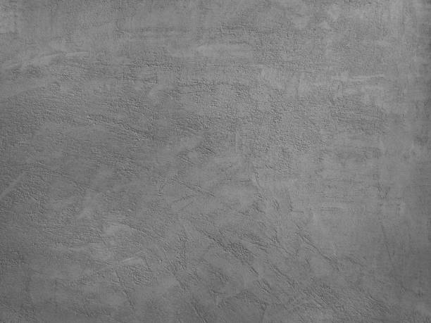 istock Black and white background. Dark gray cement background.Plastered concrete wall texture. Close-up. 1265167648