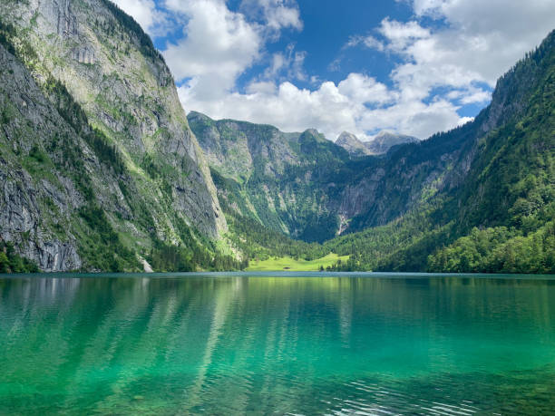 Alpine lake Koenigssee Obersee Breathtaking view of turquoise green alpine lake Koenigssee Obersee in Berchtesgaden national park surrounded by Alps mountains in Bavaria Germany berchtesgaden national park photos stock pictures, royalty-free photos & images