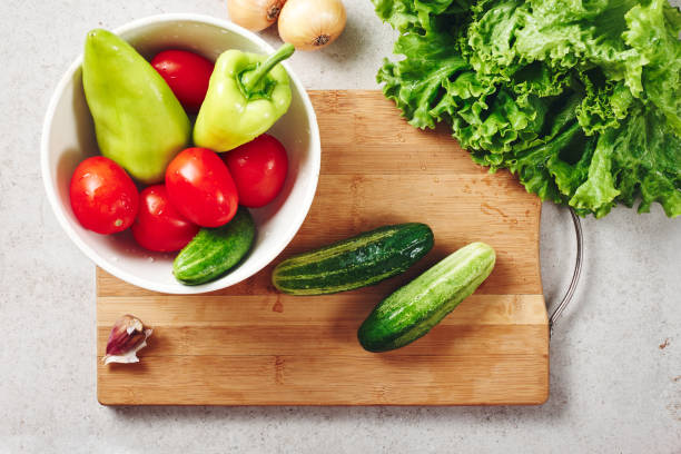 istock Fresh vegetables on a cutting board, salad ingredients. 1265168546