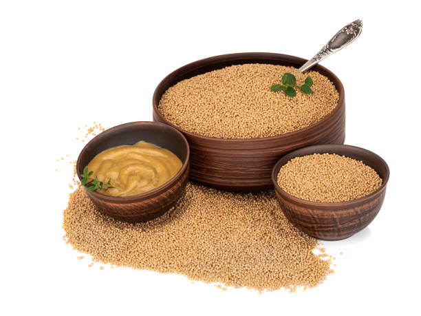 istock Mustard in a plate and mustard seeds 1265168843