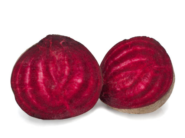 istock Two halfs of red beetroot isolated on white background 1265169894