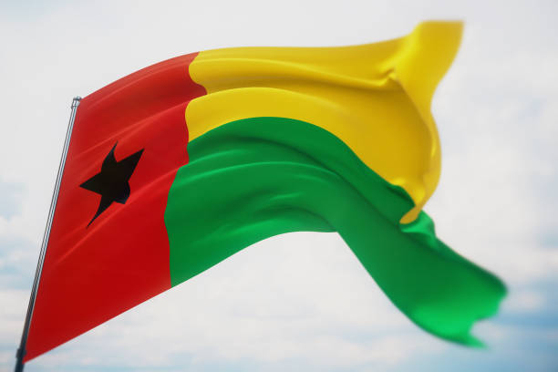 ondeando banderas del mundo - bandera de guinea-bissau. disparo con una profundidad de campo poco profunda, enfoque selectivo. ilustración 3d. - guinea bissau flag fotografías e imágenes de stock