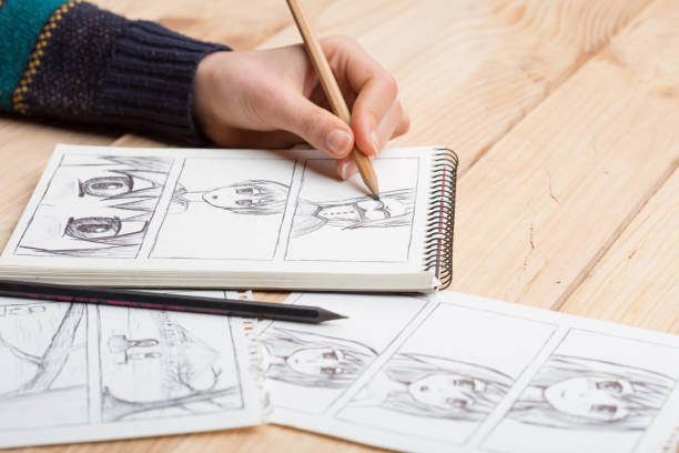 istock Artist drawing an anime comic book in a studio. 1265174678