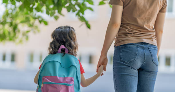 istock Parent and pupil go to school 1265175432