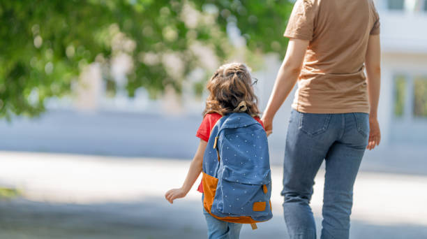 istock Parent and pupil go to school 1265175437