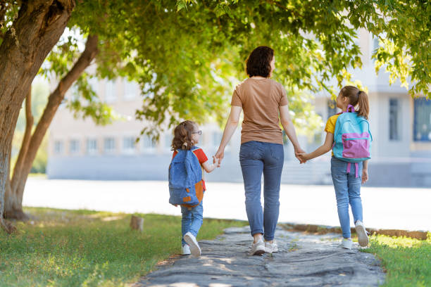 istock Parent and pupils go to school 1265175492