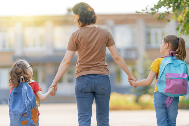 istock Parent and pupils go to school 1265176027