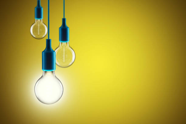 istock Idea and leadership concept - bulbs on the yellow background 1265176066