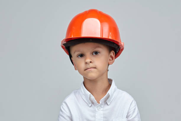 istock little boy in a construction helmet. advertising concept for the construction. 1265176084