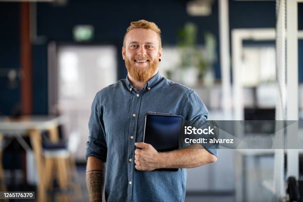 Portrait Of A Confident Young Businessman Stock Photo - Download Image Now - Men, Portrait, Office