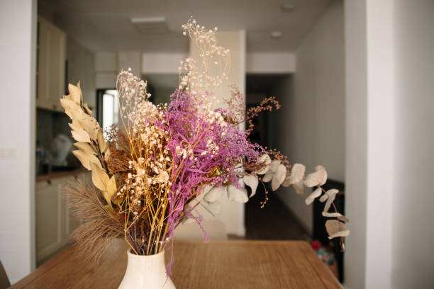 Dried flowers arrangement in a vase inside a house
