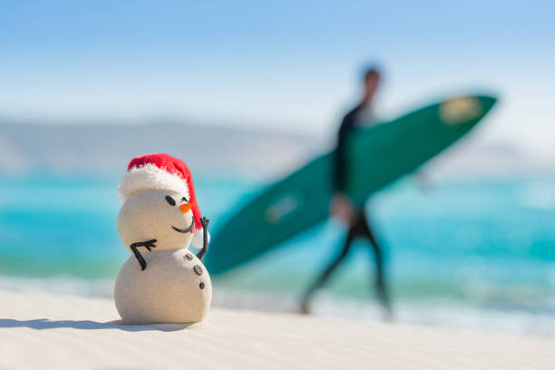 istock Sandy Christmas Snowman is celebrating Christmas 1265178041