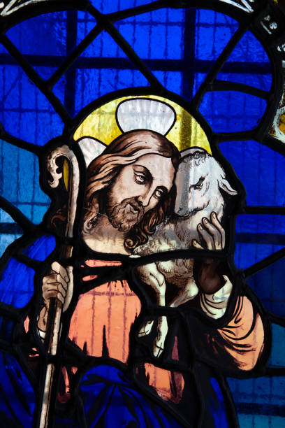 istock Stained glass window of Jesus and lamb 1265178079