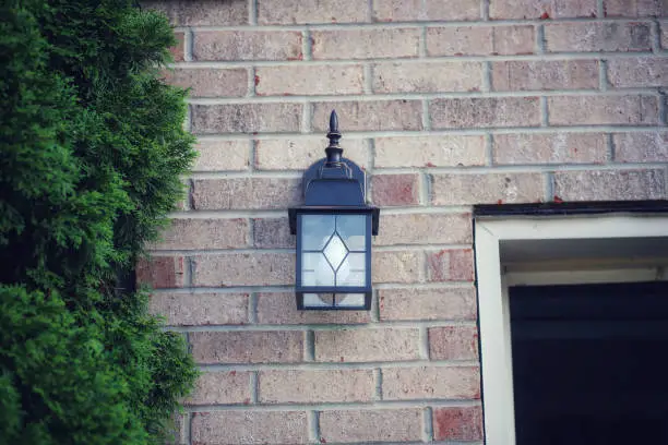 Photo of An outdoors light fixture on the exterior of a home