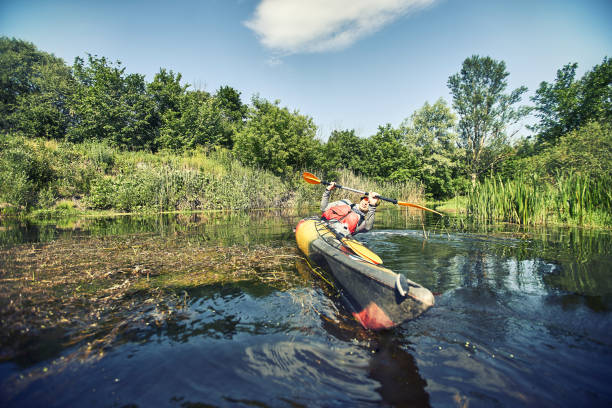 istock Happy best friends having fun on a kayaks. Kayaking on the river. 1265178266
