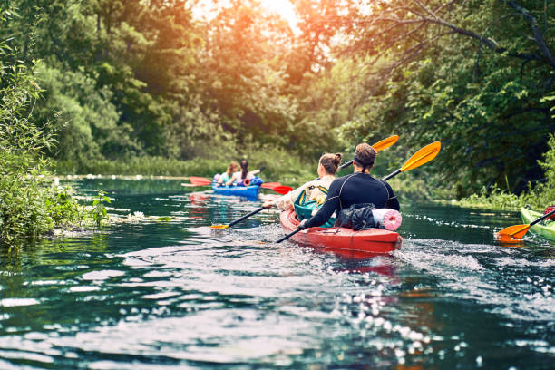 istock Happy best friends having fun on a kayaks. Kayaking on the river. 1265178268
