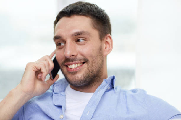 istock happy man calling on smartphone at home 1265182556