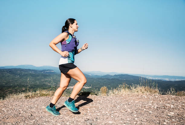 istock Woman running on mountain. 1265182784