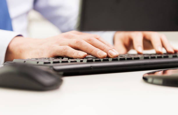 istock close up of businessman hands typing on keyboard 1265183496