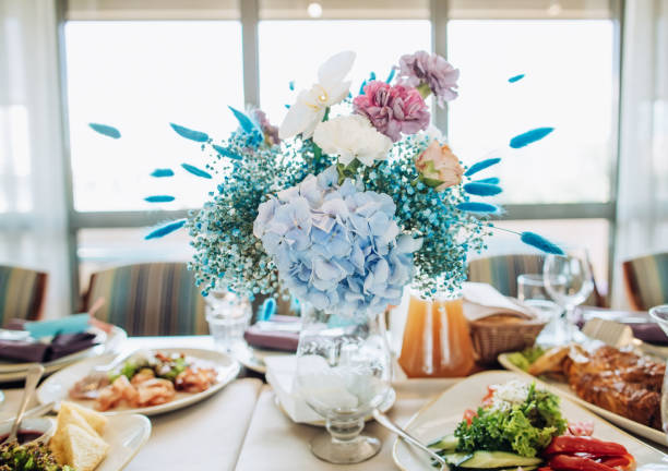 White roses bouquet on the wedding table