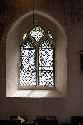 View of a stained glass window from the inside on an English church