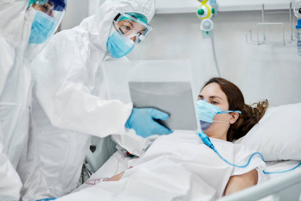 istock Doctors Holding Tablet for Patient Video Call during COVID-19 1265186469