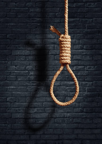 istock suicide concept. noose with shadow on dark wall background 1265186799