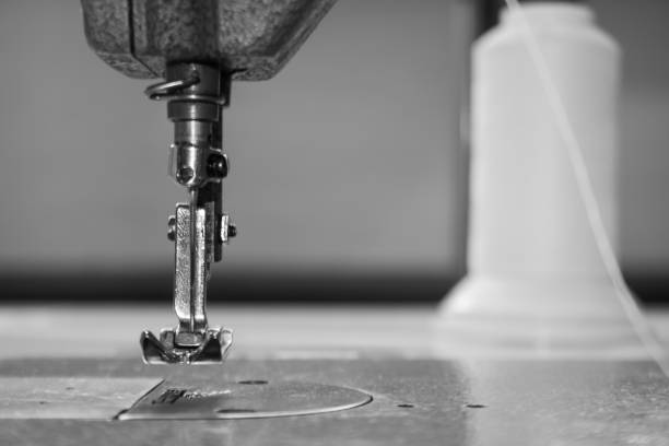 istock sewing machine foot and needle. Close up, macro. Empty space for text. Craft fabric industrial. 1265188899