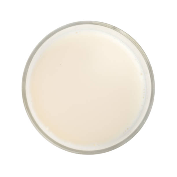 istock Glass of milk isolated on white background 1265193476
