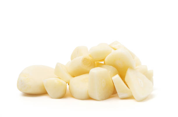 istock fresh raw garlic cut slice isolated on white background 1265193529